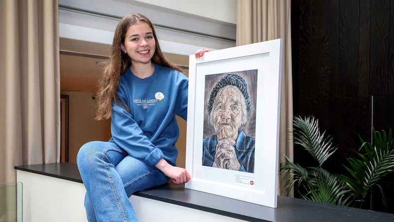 Charley Bell with her award-winning portrait titled 'Anticipation'.