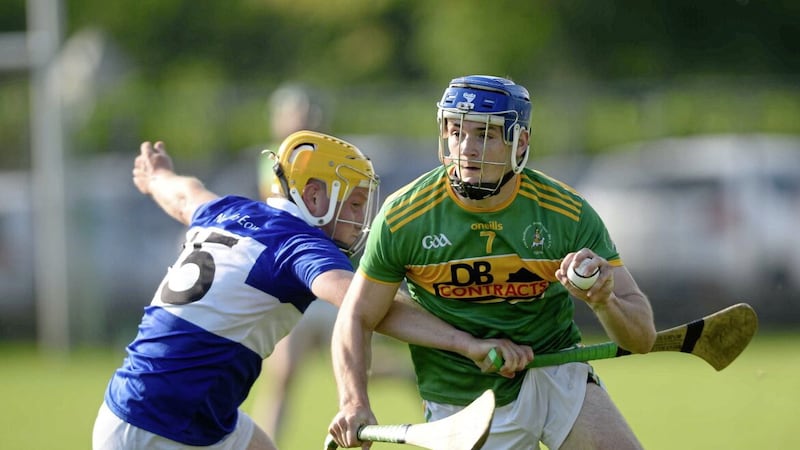 Dunloy&rsquo;s Eoin McFerran tries to evade St John&#39;s Oisin MacManus during Saturday&#39;s group game in Dunloy Picture: Mark Marlow 