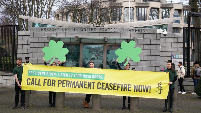 Protesters holding a banner reading "President Biden, listen to your Irish roots. Call for permanent ceasefire now!" outside  the US embassy in Dublin