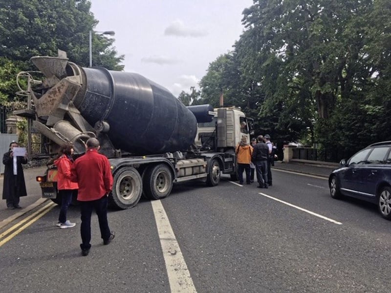Residents try to stop a cement mixer arriving at the Chinese Consulate on Malone Road in south Belfast. Picture by Mal McCann 
