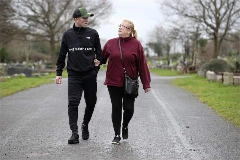Carol Corr pictured with her son, Jim in the city cemetery in Belfast where her daughter, Joleen is buried. Picture: Hugh Russell 