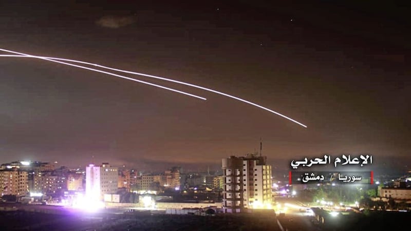 Missiles rise into the sky as Israeli missiles hit air defense position and other military bases, in Damascus, Syria on Thursday Picture by Syrian Central Military Media, via AP 