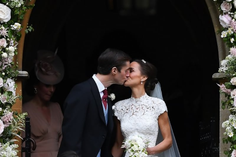 Pippa Middleton and her husband James Matthews kiss