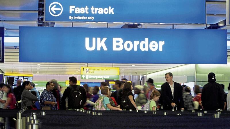 Passengers going through the UK Border at Terminal 2 of Heathrow Airport 