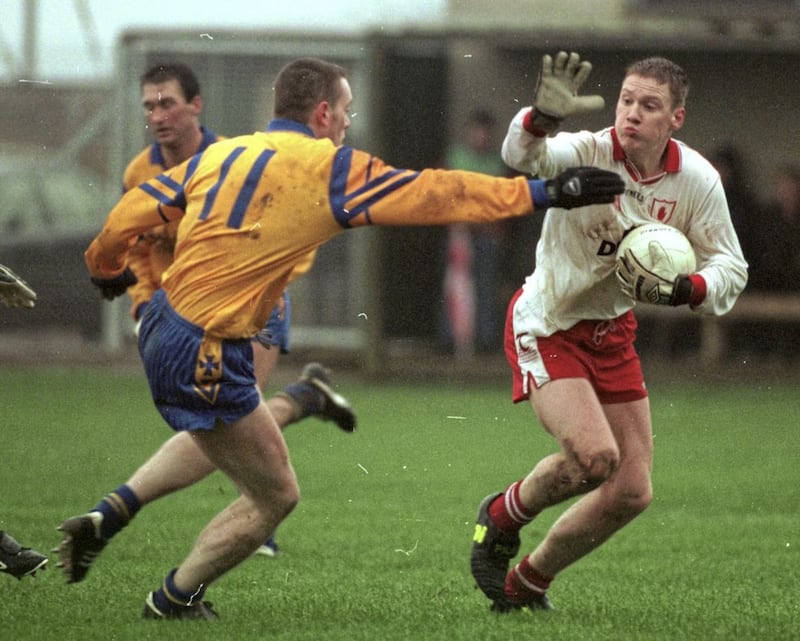 Cormac McAnallen trying to go round Roscommon's Derek Dougan in a 1999 game in O'Neill Park, Dungannon. Picture by Oliver McVeigh&nbsp;