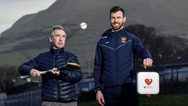 23 March 2021; Antrim hurler Neil McManus and his father Hugh at Cushendall GAA Club in Antrim. Neil is an ambassador for the GAA Community Heart Programme which seeks to raise awareness of the benefits of defibrillators to clubs and make it possible to fundraise to acquire them. Neil&#39;s work is inspired by his family experience five years ago when his father was saved by the presence of a defibrillator in the community during an emergency. GAA club-based defibrillators have been used to save 42 lives. For more information see:  https://savealife.communityheartprogram.com/gaa. Photo by David Fitzgerald/Sportsfile *** NO REPRODUCTION FEE *** 