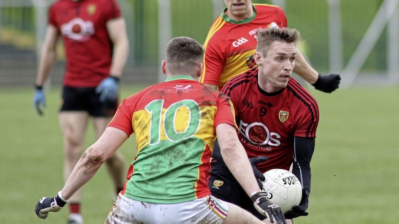 Caolan Mooney scored one point in injury-time and was involved in the other as Down clinched a crucial win in Carlow last Saturday 