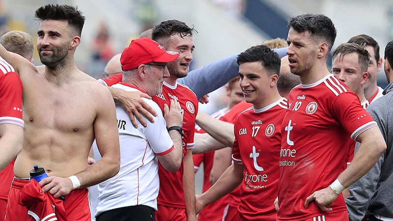 Tyrone manager Mickey Harte celebrates with his players after yesterday's one-point win over Monaghan&nbsp;