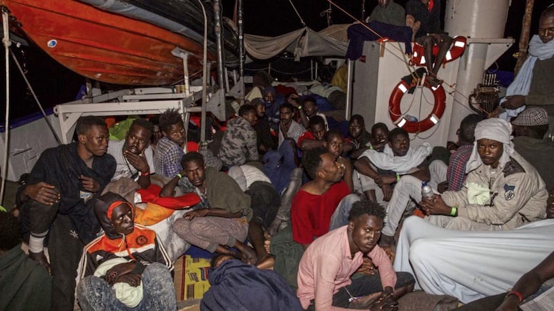 Rescued migrants sit in the search and rescue ship of German aid group Mission Lifeline Picture: Mission Lifeline via AP 