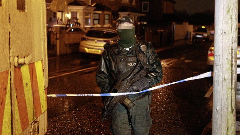 Police attend the scene of a paramilitary-style attack in Whiterock Drive on Friday night. Picture by Matt Bohill 