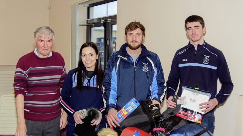 Hard at work sorting through the donations are, from left, Ballyhegan Davitt&rsquo;s chairman Leo Marley and players Clare Lavery, Rory McKeever and Conor McGlinchey 