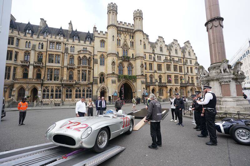 The Mercedes-Benz 300 SLR 722 is delivered outside Westminster Abbey
