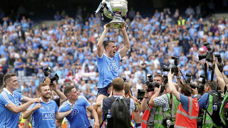 Dublin&#39;s Cormac Costello celebrates with the Sam Maguire Cup after the Dubs beat Tyrone to win the 2018 All-Ireland Senior Football Championship. Picture by Seamus Loughran. 