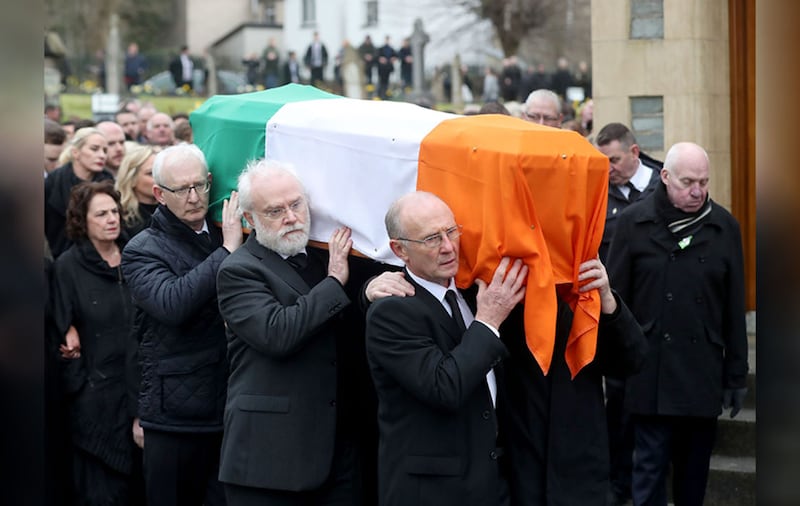 &nbsp;The coffin of Martin McGuinness is carried into St Columba's Church Long Tower, for his funeral Mass. Picture by Niall Carson, PA