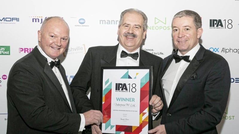 Thomas Carey, left and Dominic Fitzpatrick, right from Interpress are pictured with Martin Lockley, managing director of Manroland 
