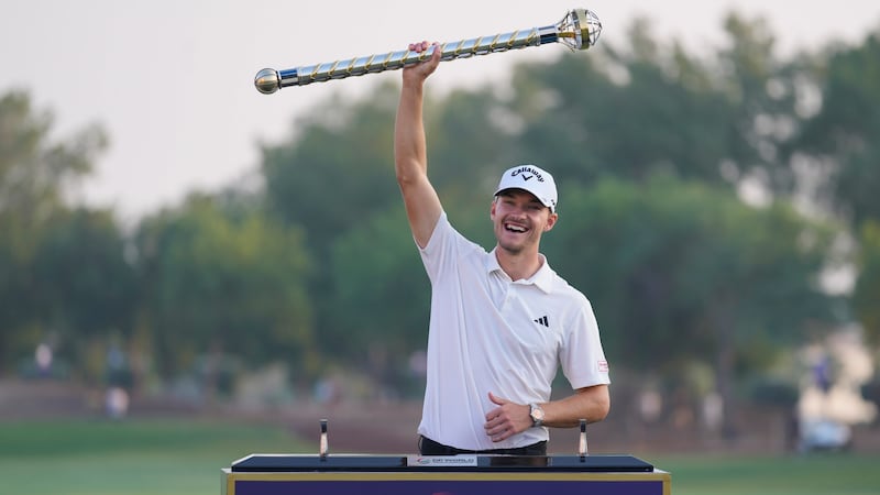 Nicolai Hojgaard of Denmark poses with his trophy after winning the DP World Tour Championship in Dubai (Kamran Jebreili/AP)