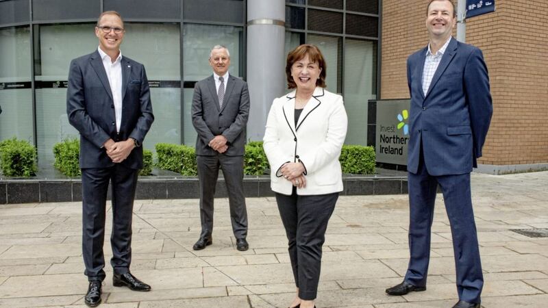 L-R: Adam Foster chief executive of Hinduja Global Solutions UK; Kevin Holand chief executive of Invest NI; economy minister Diane Dodds; and Mark Hooper, chief financial officer HGS UK. 
