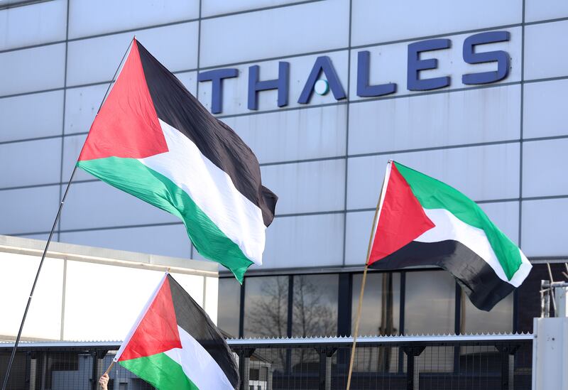 Palestine flags flying by supporters as they protest at the entrance to the Thales arms manufacturer in east Belfast. PICTURE: MAL MCCANN