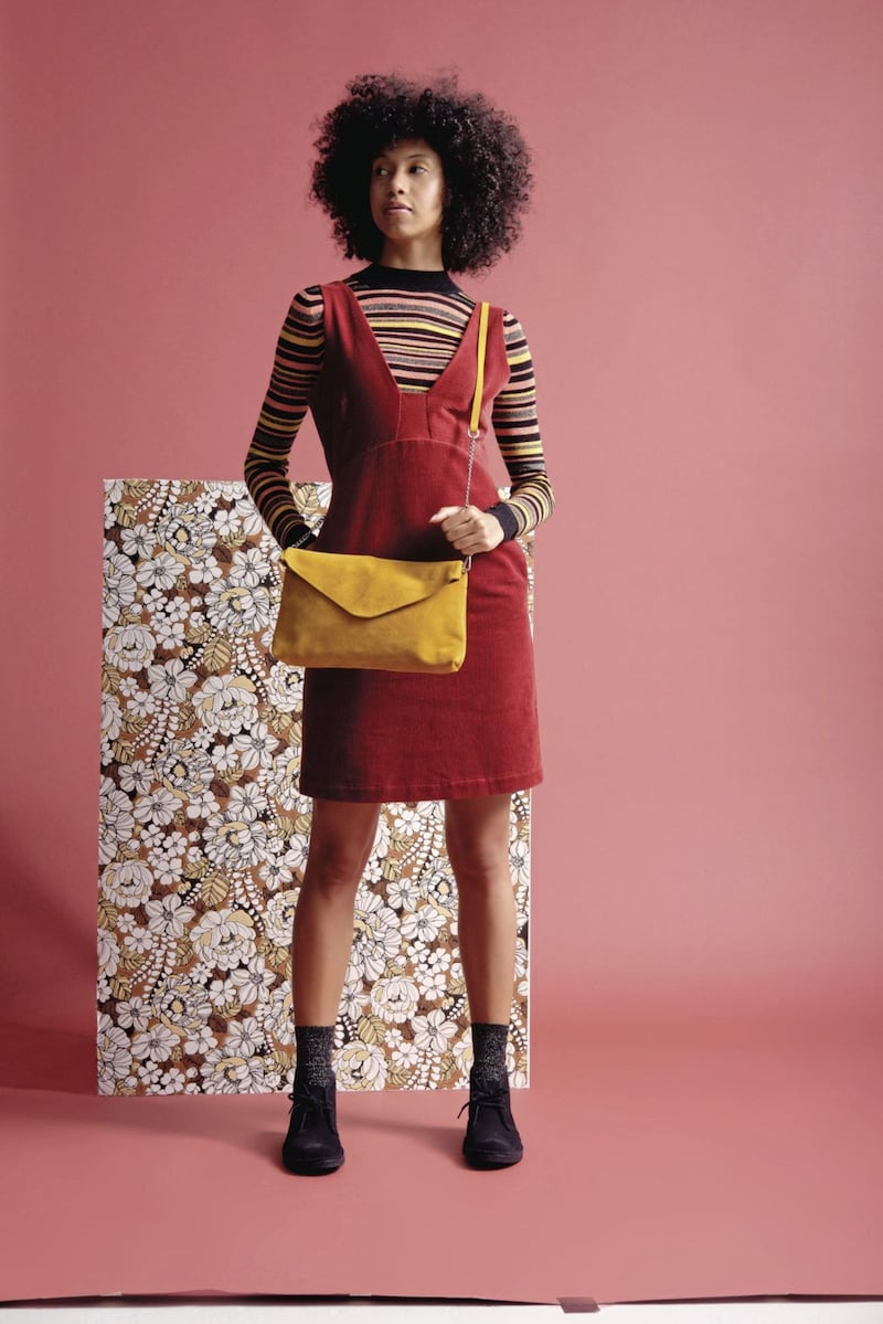 Oliver Bonas Alma Shimmer Striped Knitted Jumper, &pound;45; Corduroy Rust Red Mini Pinafore Dress, &pound;65; Yellow Suede Leather Envelope Crossbody Bag &pound;59.50 
