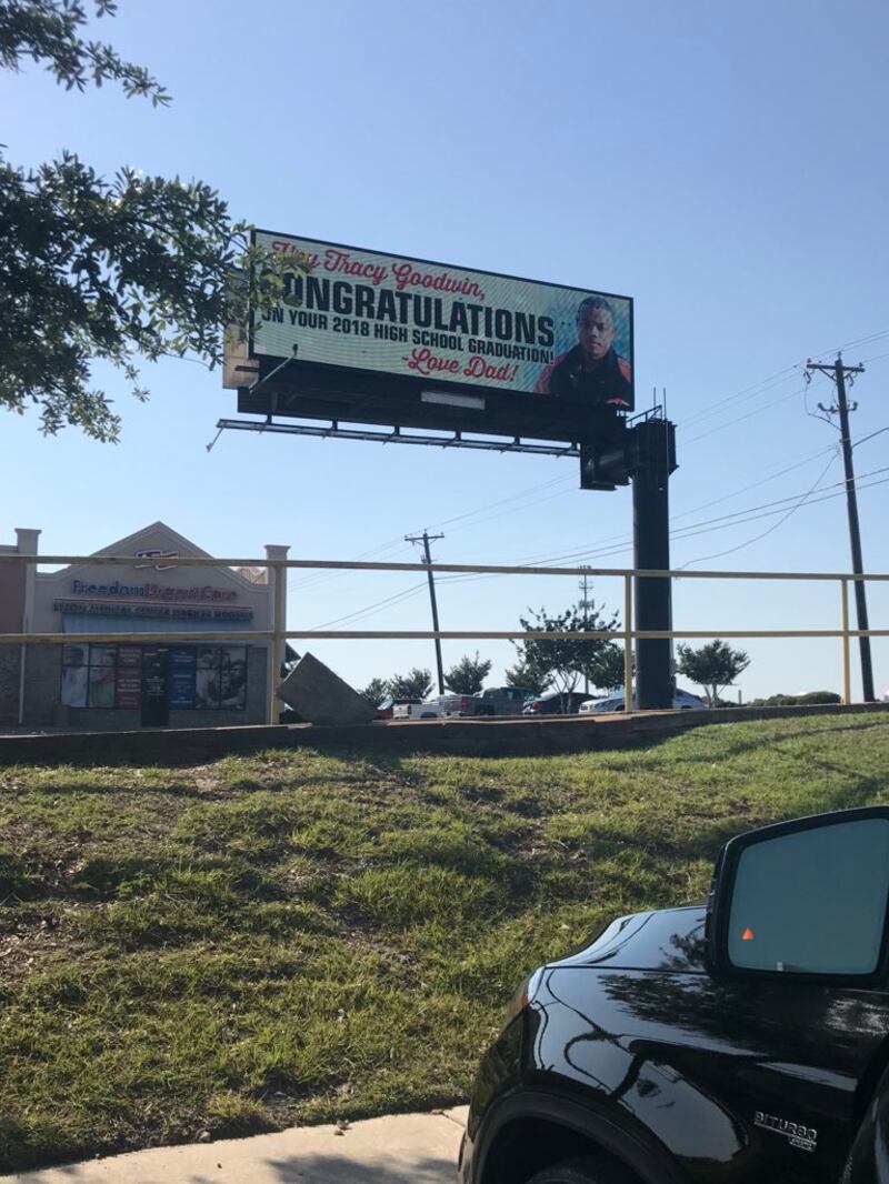 The billboard with Tracy wearing a fleece
