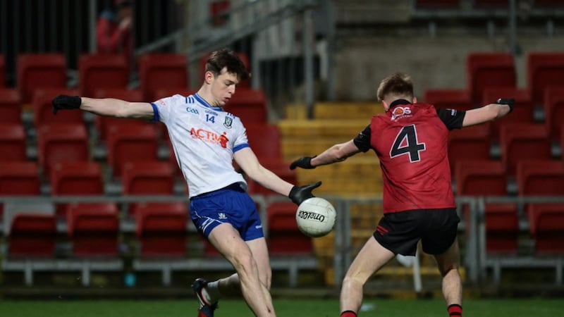 Down's Mark McSwiggan closes in on Monaghan forward Bobby McCaul during Wednesday night's Ulster Championship Section A clash