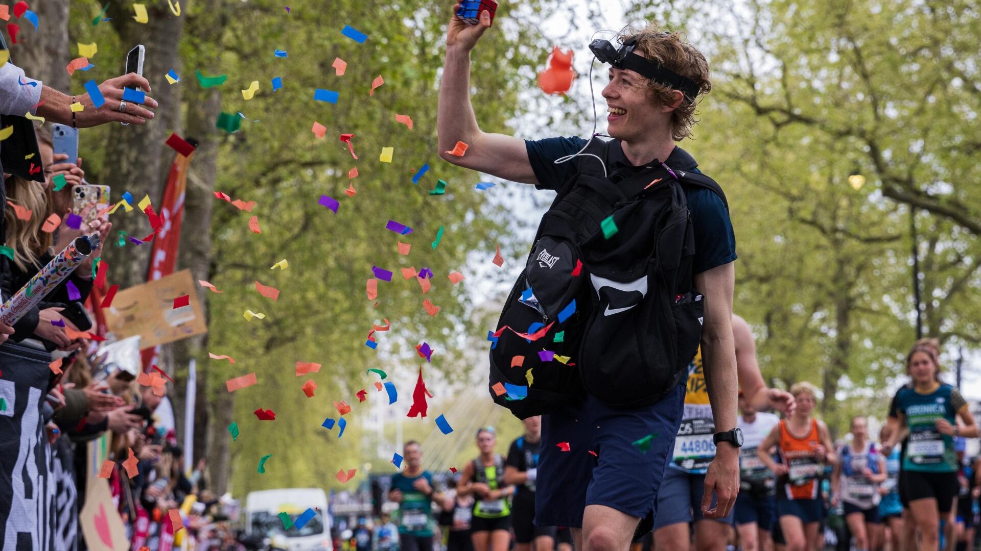 George Scholey has broken the world record for the most Rubik’s Cubes solved while running a marathon