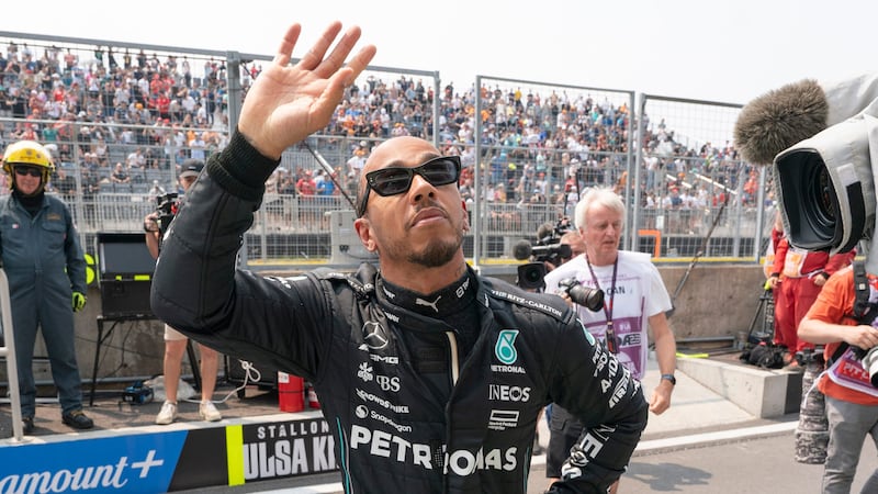 Mercedes driver Lewis Hamilton, of Great Britain, waves to the crowd during a suspended first practice session at the Canadian Grand Prix in Montreal, Friday, June 16, 2023. (Paul Chiasson/The Canadian Press via AP)