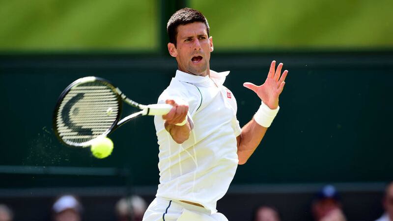 Novak Djokovic in action against Jarkko Nieminen during day Three of the Wimbledon Championships at the All England Lawn Tennis and Croquet Club, Wimbledon. P 