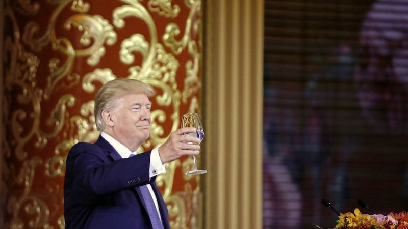 US president Donald Trump toasts at a state dinner at the Great Hall of the People in Beijing, China PICTURE: Thomas Peter/AP 