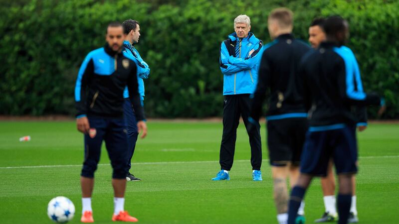 Arsenal manager Arsene&nbsp;Wenger&nbsp;(centre) watches over the training session at London Colney Training Ground ahead of their Champions League group match against Bayern Munich