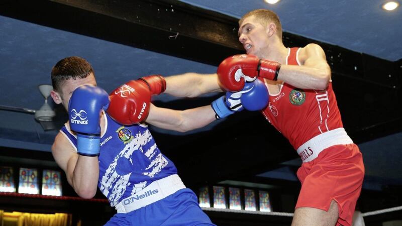 Conor Wallace Red) fights Gerard French at the Ulster Elite Championships in the Dockworkers Club Belfast last year. Picture by Hugh Russell.. 