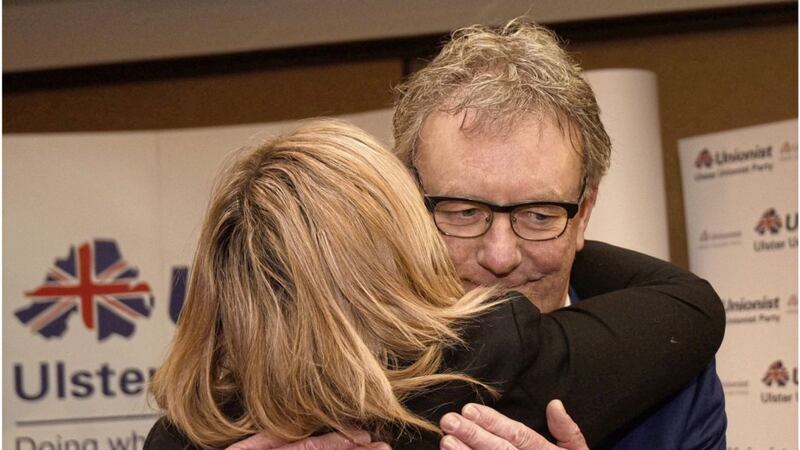 Ulster Unionist leader Mike Nesbitt is embraced by his wife Lynda after announcing his resignation. Picture by Hugh Russell 