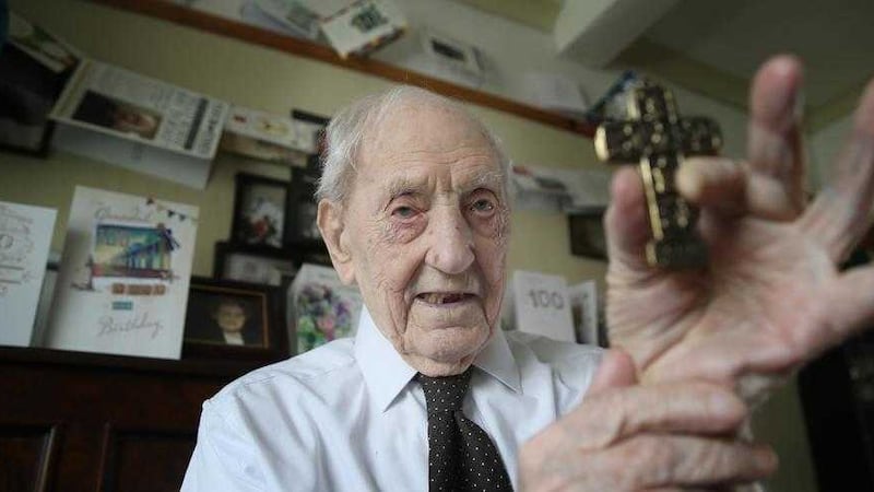 Billy Burns, pictured at his west Belfast home, with just one of his many awards ahead of getting the Benemerenti medal&nbsp;