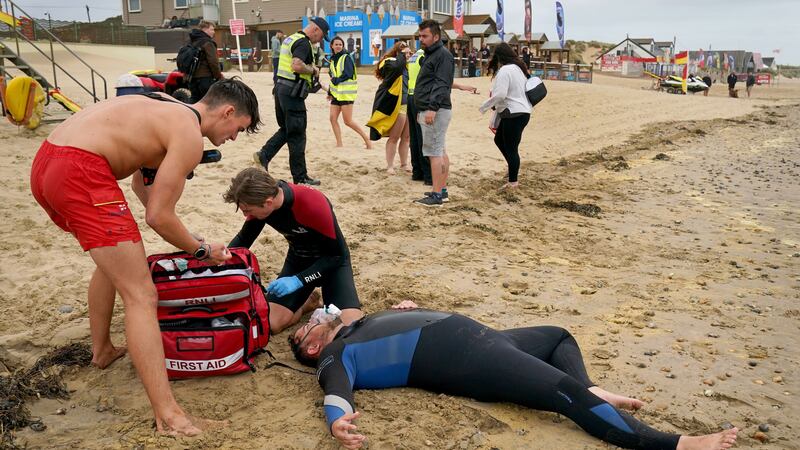 Lifeguards practise their skills on an actor during a multi-agency exercise to test emergency response at Camber Sands (Gareth Fuller/PA)