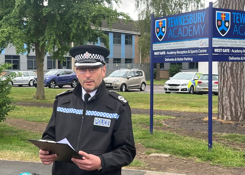 Assistant Chief Constable Richard Ocone, of Gloucestershire Police, reads a statement to reporters outside Tewkesbury Academy in Gloucestershire after the alleged attack