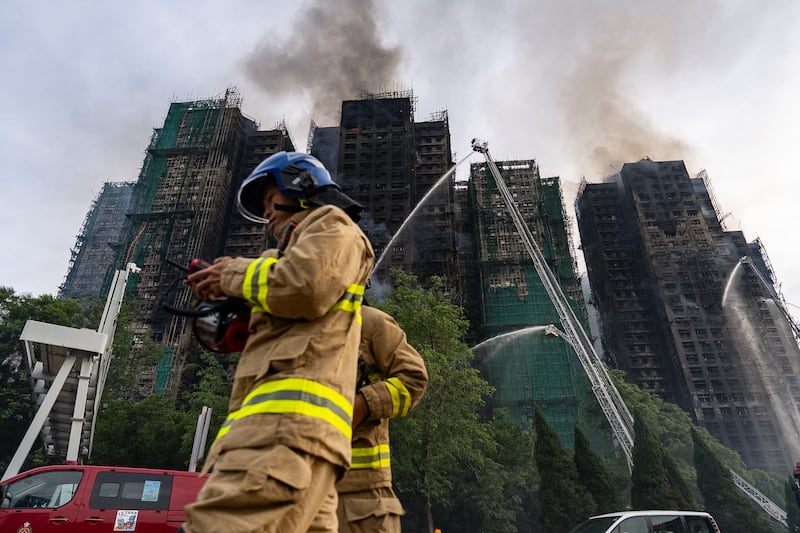 Firefighters continue to tackle deadly Hong Kong tower blaze