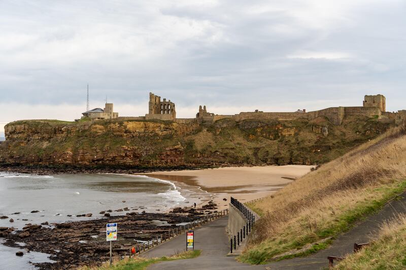 Scenic view of King Edward's Bay beach, looking towards Tynemouth Priory and Castle, in Tynemouth, UK