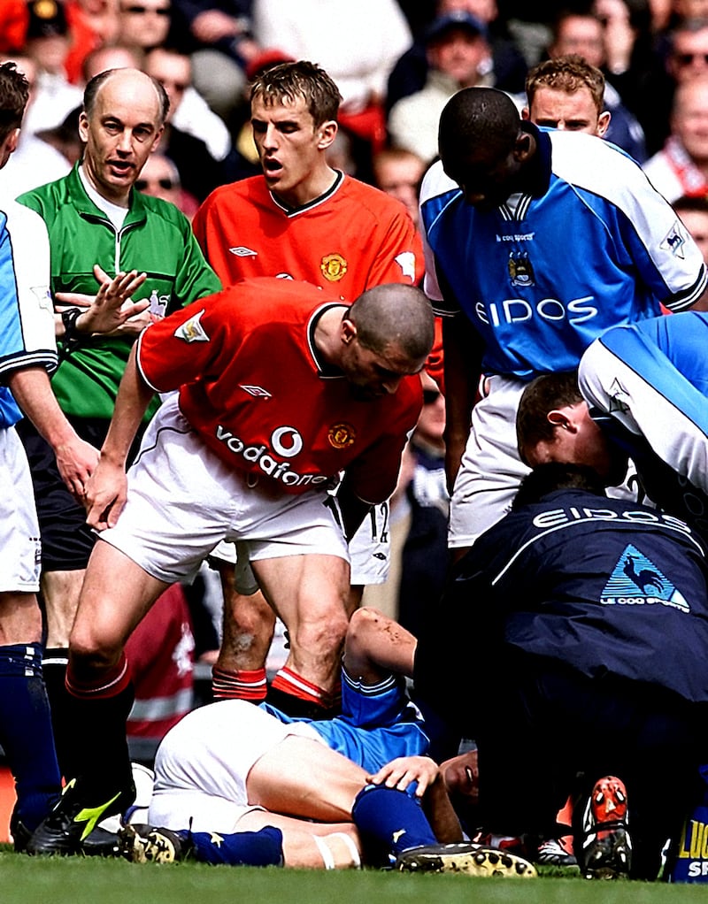 Roy Keane shouts at Manchester City’s Alf-Inge Haaland (on ground) after being shown a red card for a horror tackle in 2001