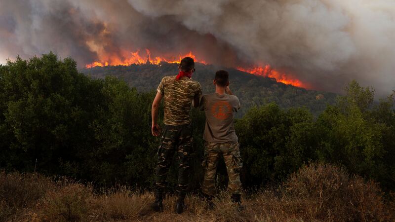Flames burn a forest near the village of Sykorrahi, near Alexandroupolis town, in the north-eastern Evros region, Greece (Achilleas Chiras/AP)