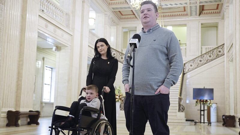 The Mac Gabhann family, including six-year-old D&aacute;ith&iacute; and his parents M&aacute;irt&iacute;n and Seph at Stormont. Picture by Hugh Russell 