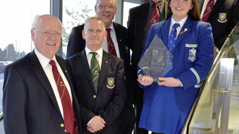 Assumption Grammar School, Ballynahinch, student Ciara Hunt with members of The Order of the Knights of St Columbanus after receiving the &#39;Honouring the Faith&#39; award. 