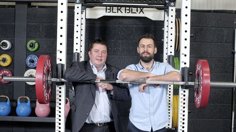 Pictured at the new larger BLK BOX premises in Belfast are James Eyre, commercial director at Titanic Quarter and Gregory Bradley, managing director at BLK BOX. 