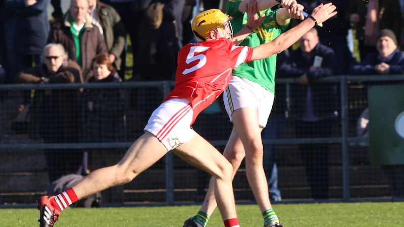 &nbsp;Loughgiel's Ciaran McKay attempts to block a shot by Dunloy's Rory Mullan with his hand during the Antrim minor hurling championship final. Picture by Sean Paul McKillop