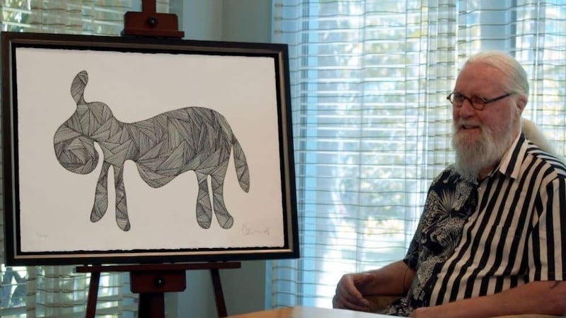 Sir Billy Connolly sits next to his newly unveiled piece, Drunken Donkey (Castle Fine Art/PA)