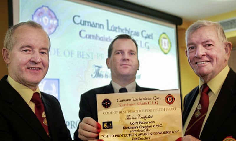 Colm Mc Larnon, Kickhams Creggan Co.Antrim, receives the first certificate in Code of Best Practice for Youth Sport,over 6,000 certificates will be distributed to Adminsitrators and Coaches who completed the &quot;Child Protection Awareness Workshop&quot; throughout the Province,also included are Michael Hasson ( members of the Ulster Council Commitee that organised the &quot;Child Protection Awareness Workshop&quot; throughout the Province ) and John O&#39;Reilly ( Past President Ulster Council ).Photo by John McAviney. 