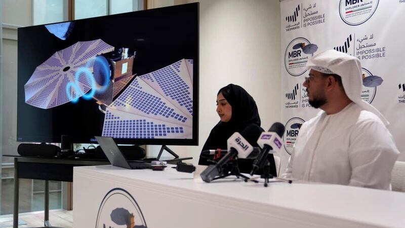 Mohsen Al Awadhi, director of UAE Space Missions Department, right, and Hoor AlMaazmi UAE, space science researcher, take part at a press conference revealing the latest news about the Emirates Mission to the Asteroid Belt, in Dubai, United Arab Emirates (Kamran Jebreili/AP/PA)