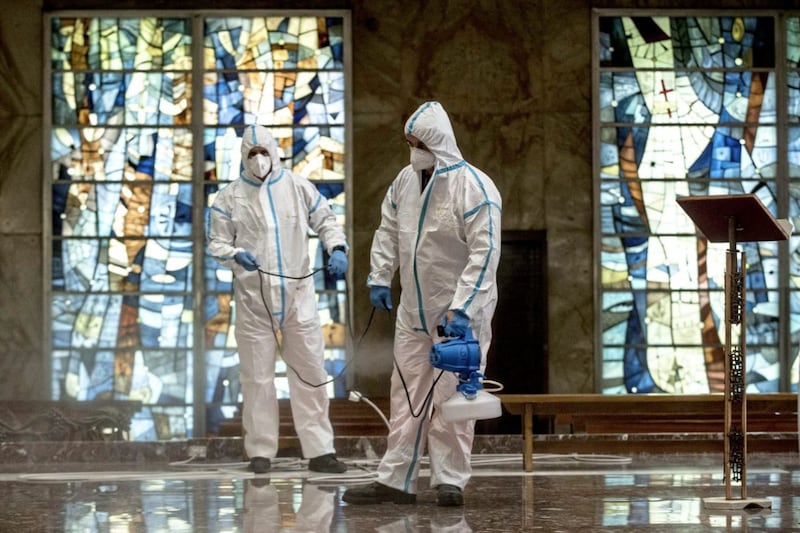 Italian Army and Rome&#39;s street cleaning task force personnel sanitise a church in Rome to prevent the spread of Covid-19. Picture by Roberto Monaldo/LaPresse via AP 