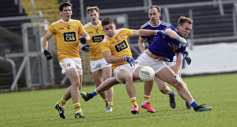 Padraig Faulkner and Martin Reilly of Cavan in action against Antrim&#39;s Patrick McBride and Kevin O&#39;Boyle Picture: Seamus Loughran 