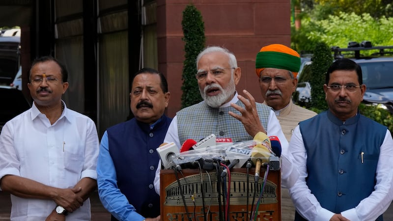 Prime Minister Narendra Modi talks to the media on his arrival at Parliament (Manish Swarup/AP)