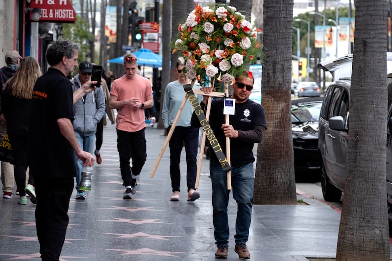 A memorial wreath is placed on the Hollywood Walk of Fame star (Richard Vogel/AP)